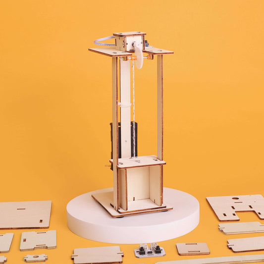 Wooden electric elevator DIY kit with pulley cables and lift platform on circular base