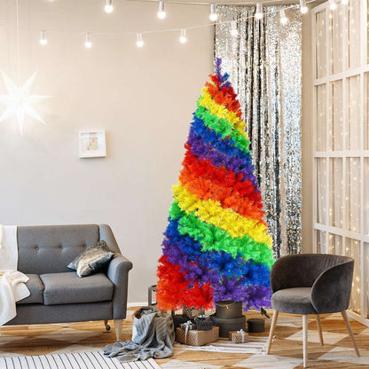 Multicolor artificial Christmas tree with broad rainbow bands and a metal stand
