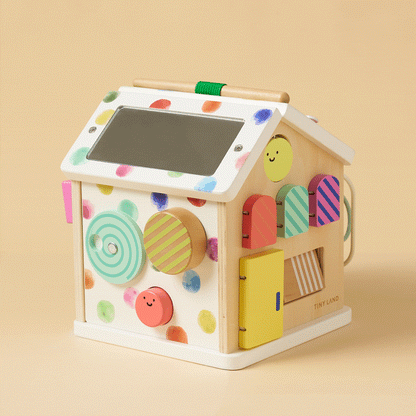Montessori cottage activity cube with rainbow bead maze and textured doors, natural wood