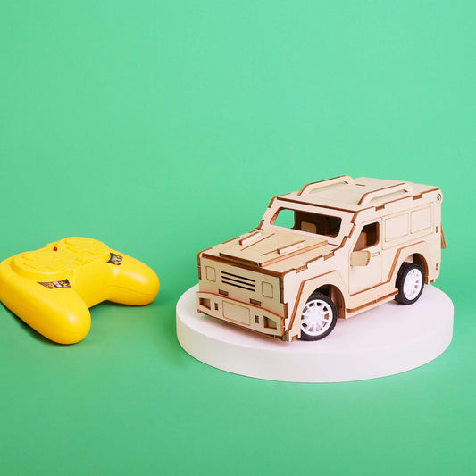 Laser-cut RC SUV model car kit in light wood finish with white wheels