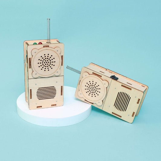 Set of 2 wooden walkie talkie STEM radios, one standing upright and one lying down