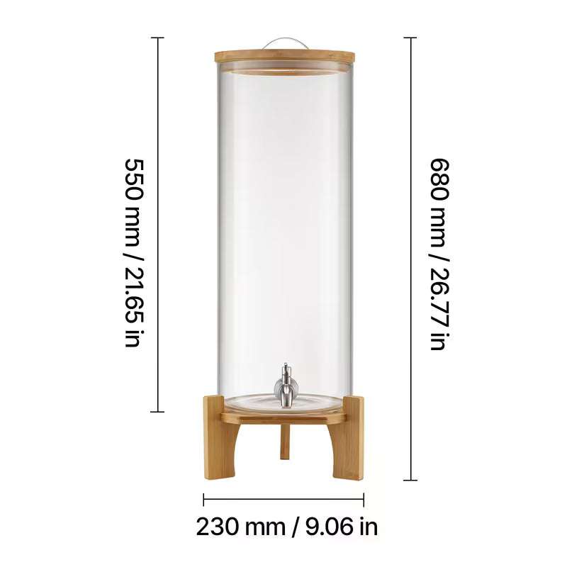 Clear glass beverage dispenser on bamboo stand with center metal spigot, tall cylinder
