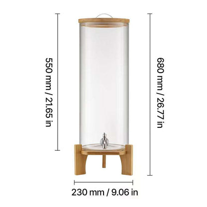 Clear glass beverage dispenser on bamboo stand with center metal spigot, tall cylinder