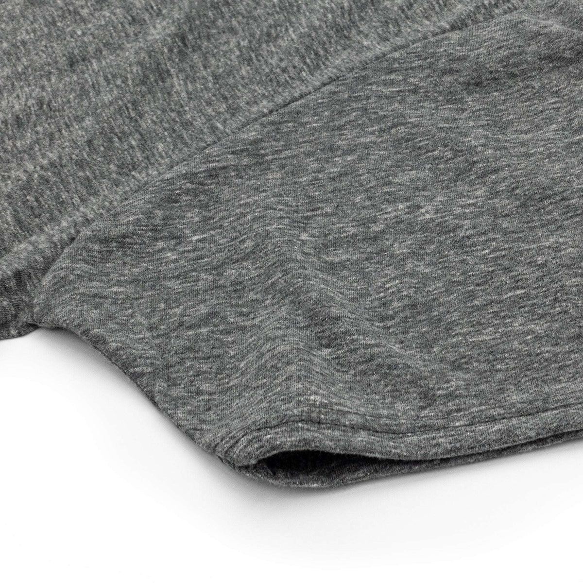 Graphite heather T-shirt sleeve and hem detail on white background