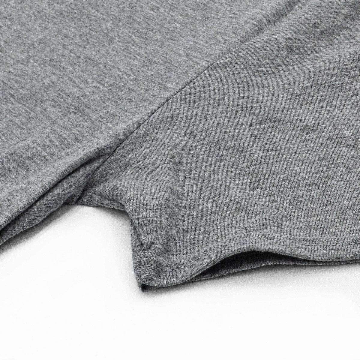 Gray T-shirt sleeve and hem seam detail