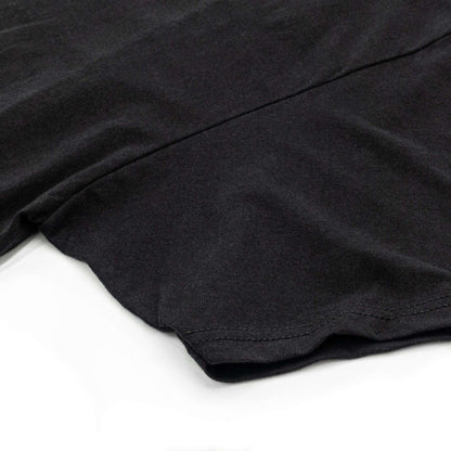 Black T-shirt with visible sleeve seam and curved hem