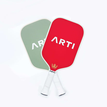 Two pickleball paddles with red and green faces and ARTI logo print