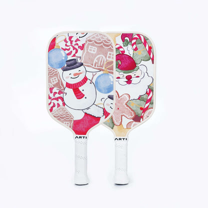 Christmas pickleball paddles featuring snowmen and candy-cane patterns