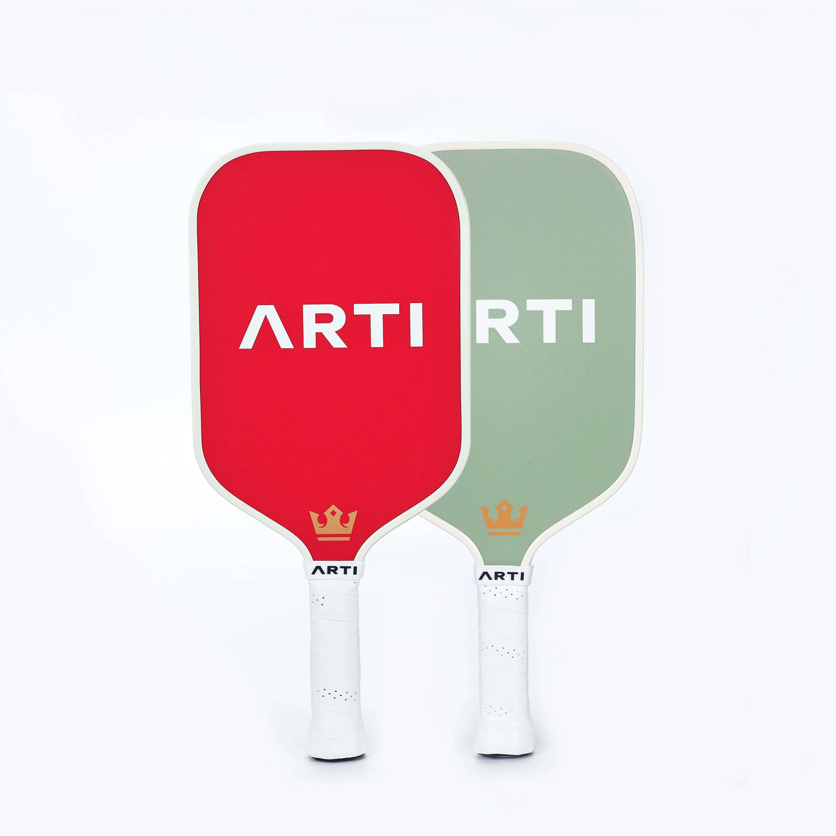 Set of two Christmas pickleball paddles with red and green faces and crowns