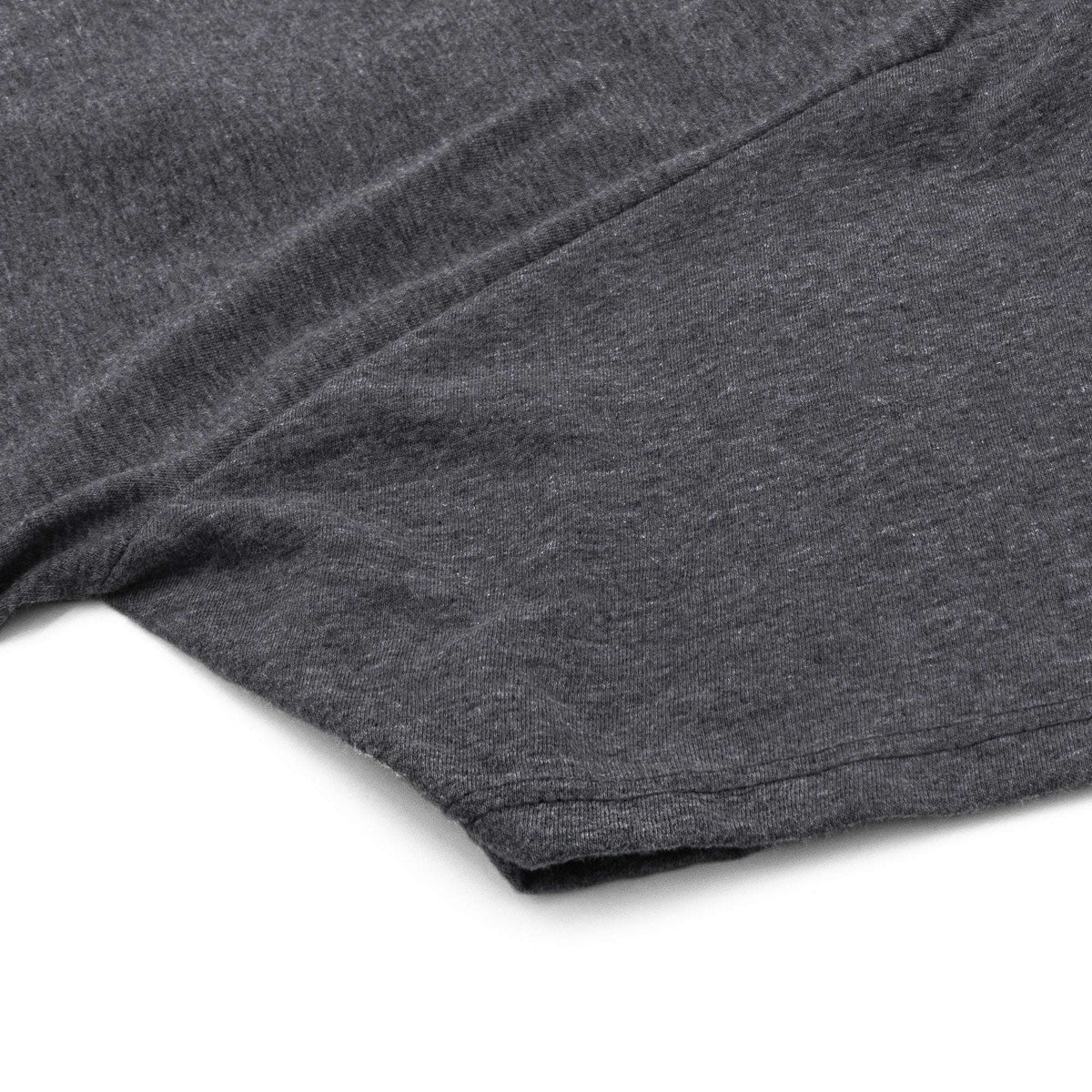 Gray T-shirt with visible fold over sleeve and hem stitching