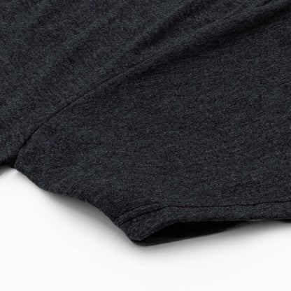 Charcoal gray T-shirt sleeve and hem detail with stitched edge.