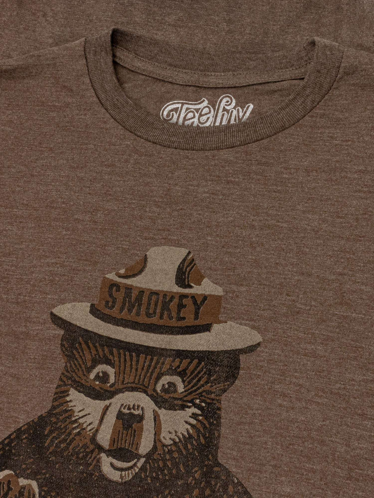 Brown T-shirt neckline and Smokey hat graphic detail on chest