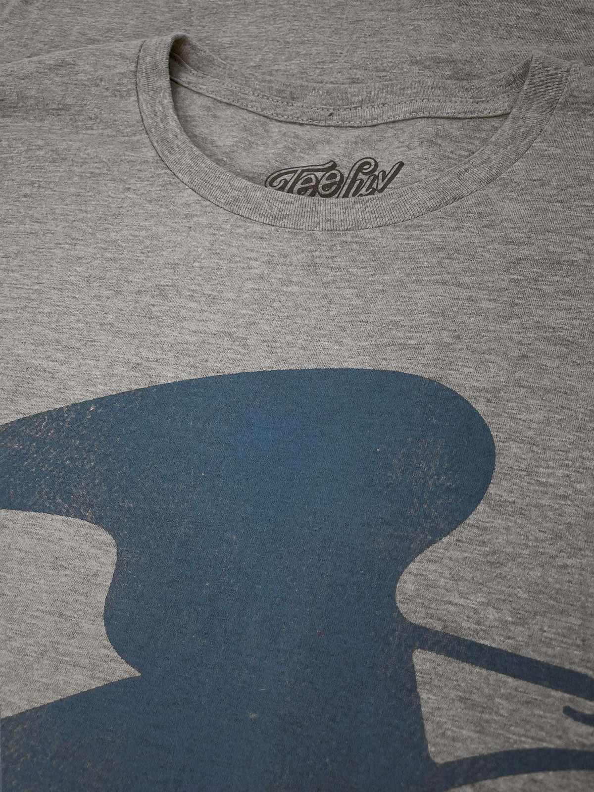 Gray T-shirt neckline with Teeluv logo