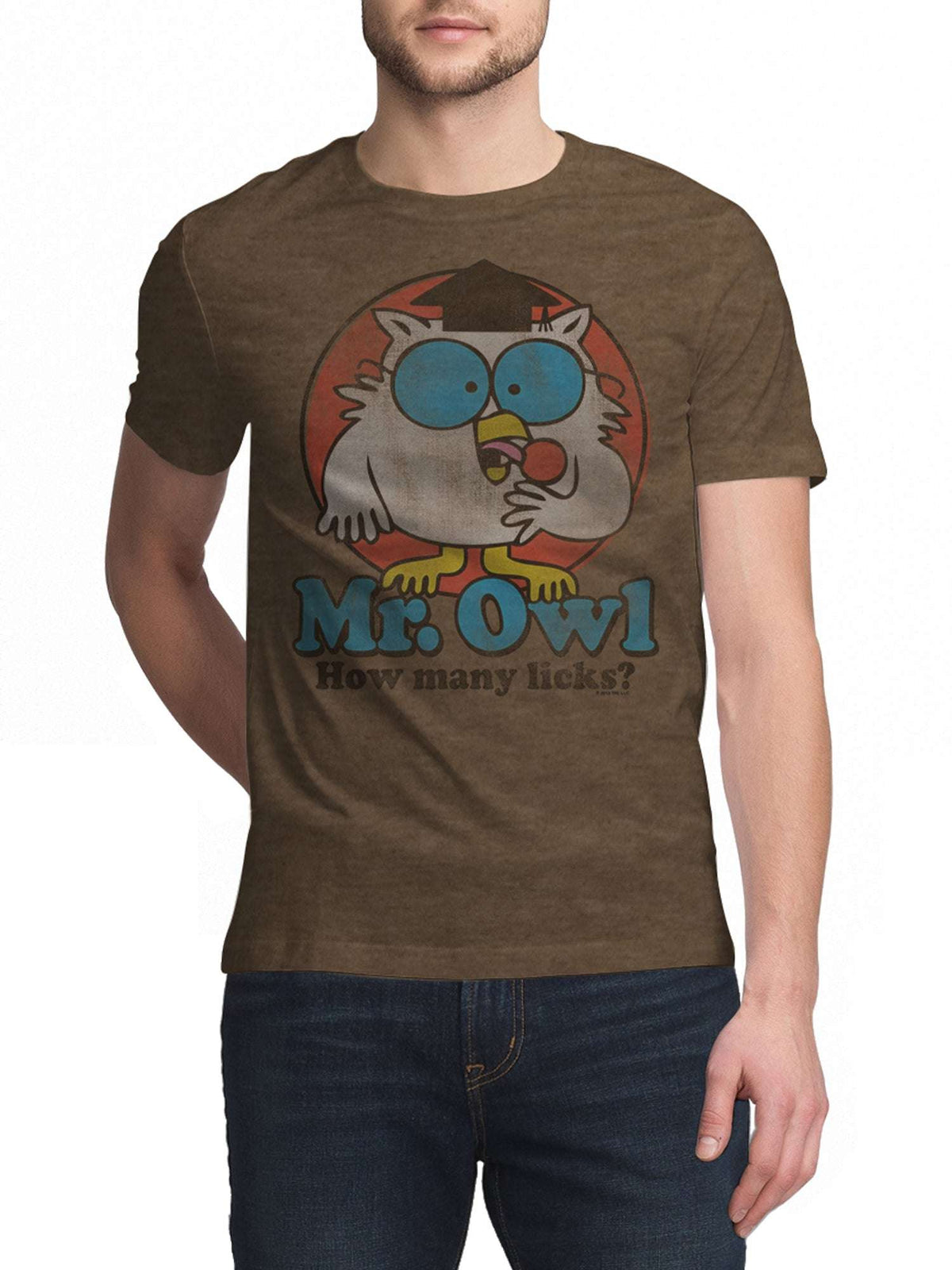 Brown graphic T-shirt worn by a man; owl illustration with “How many licks?”