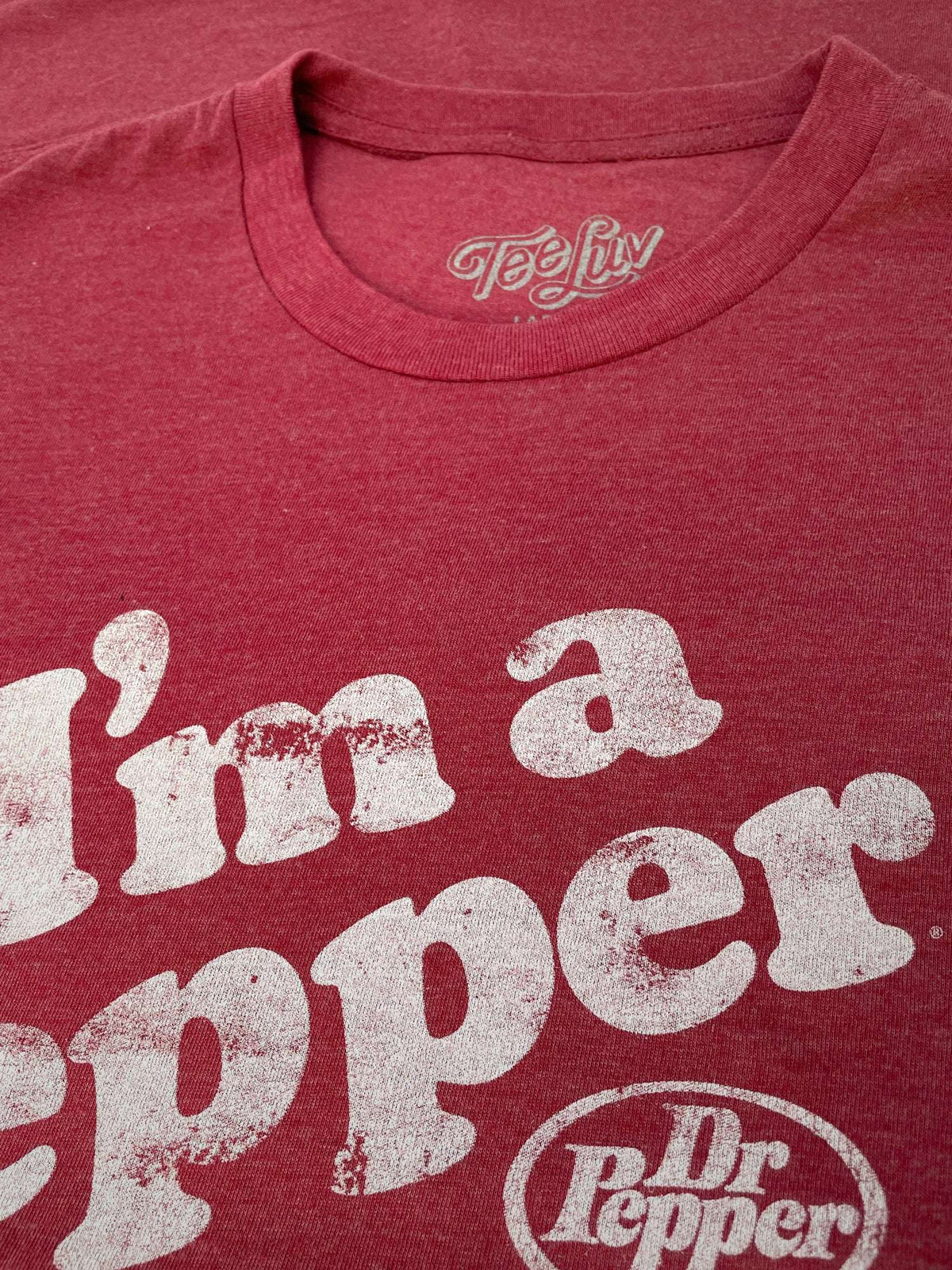 Red T-shirt close-up with 'I'm a Pepper' text and Dr Pepper logo