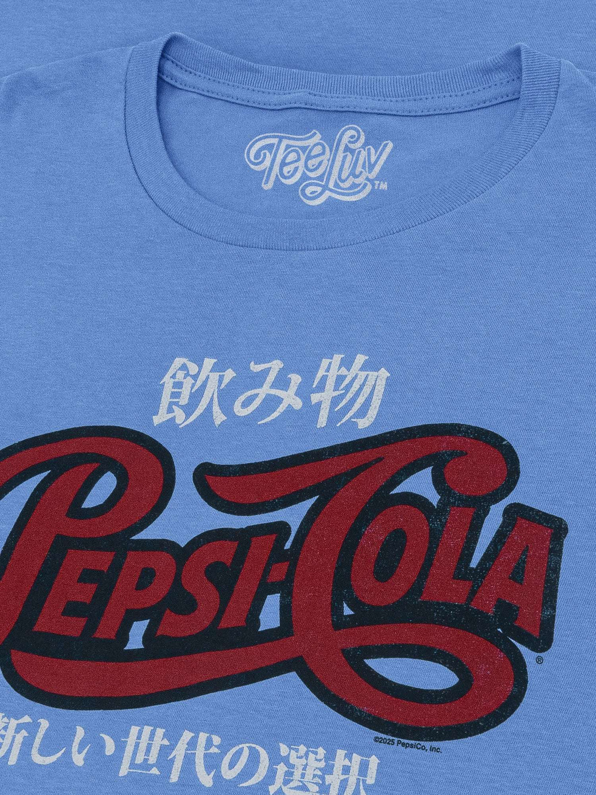 Light blue heather T-shirt close-up of TeeLuv neck label and Pepsi graphic
