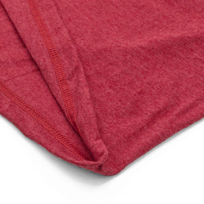 Red T-shirt fabric fold with stitched seams close-up