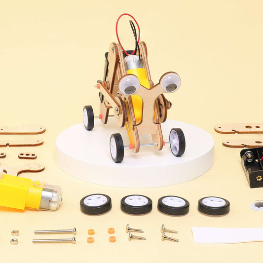 Crawling bug robot STEM kit on round platform with wheels and scattered build parts