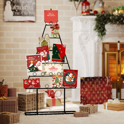 Black metal Christmas tree photo holder displaying cards on circular clips.
