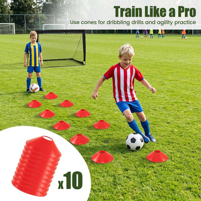 Portable soccer goal set with red training cones arranged for dribbling practice.