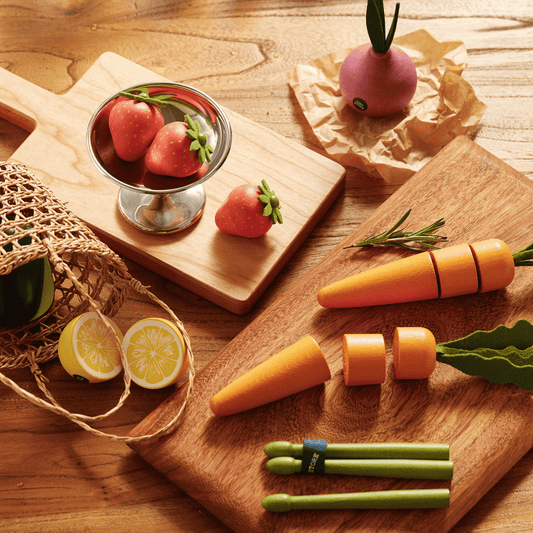 Felt fruit and veggie play food pieces with strawberries, peas, carrots, and lemon slices