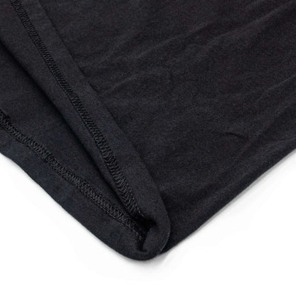 Black T-shirt sleeve hem with visible stitched seam