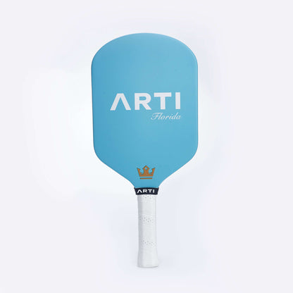Blue pickleball paddle with ARTI Florida logo