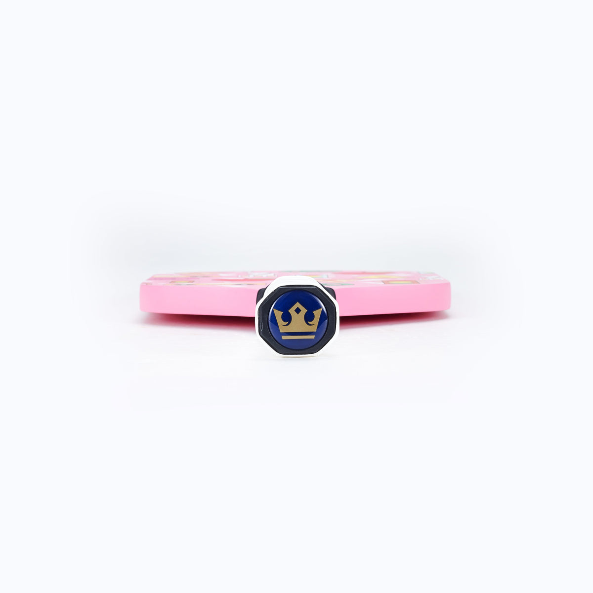 Pink pickleball paddle side with blue emblem on the edge and white grip