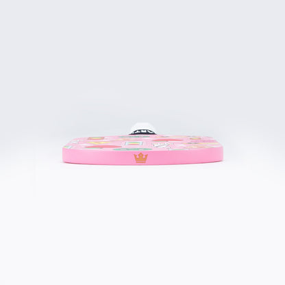 Pink pickleball paddle face with colorful graphics and black edge