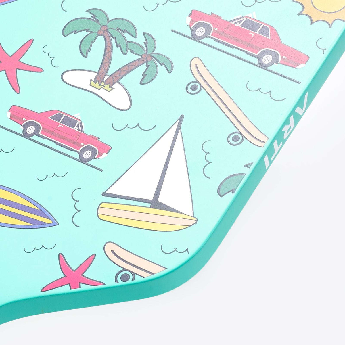 Close-up of mint pickleball paddle face with tropical icons pattern.