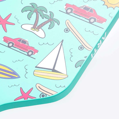 Close-up of mint pickleball paddle face with tropical icons pattern.