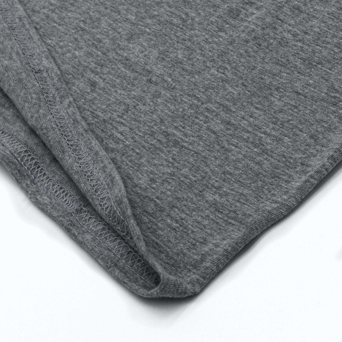 Gray T-shirt bottom hem with stitched edging detail