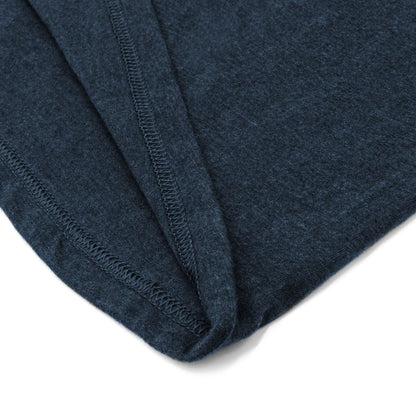 Navy heather T-shirt corner showing reinforced stitching at the hem