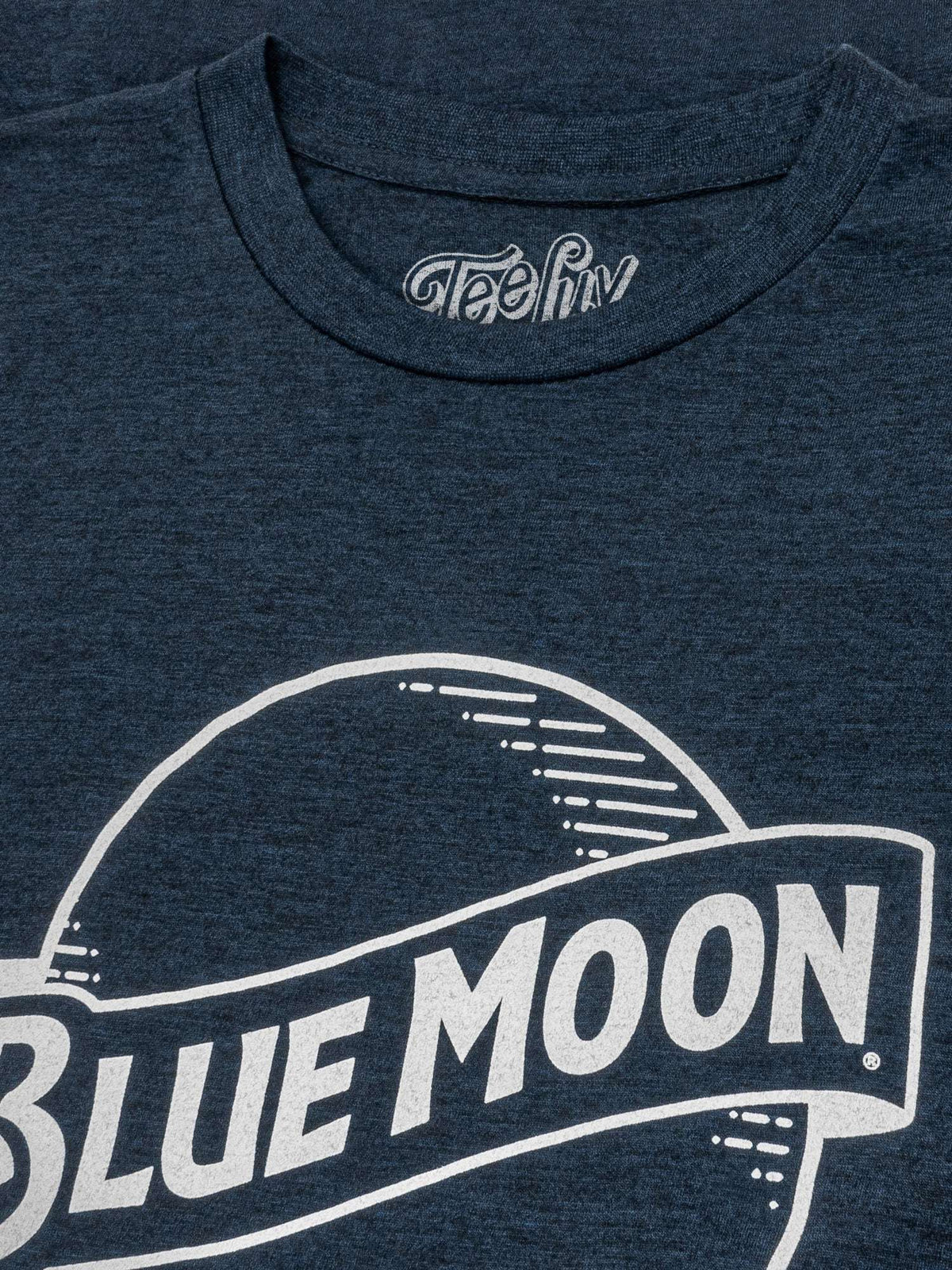 Navy heather T-shirt chest close-up with Blue Moon logo and Tee-Luv neck label