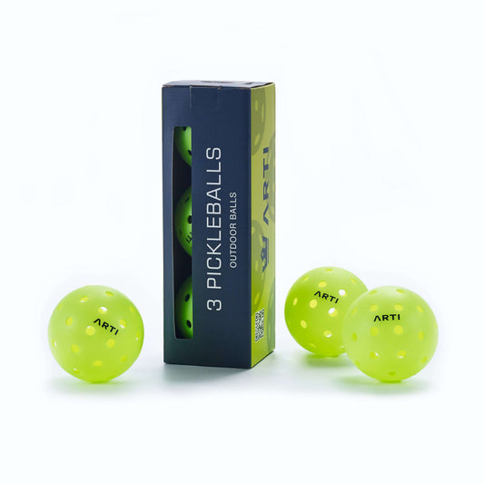 High-visibility neon pickleball balls with ARTI logo and retail box packaging