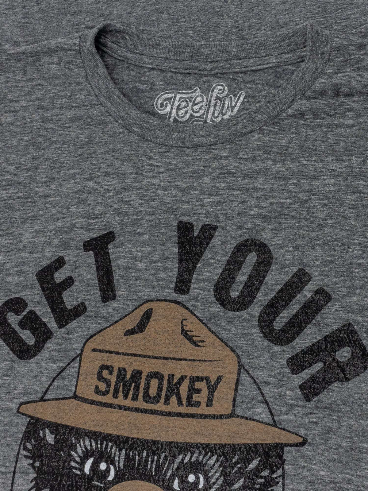 Gray T-shirt neckline with 'Teeluv' collar print and 'Get Your Smokey On' graphic