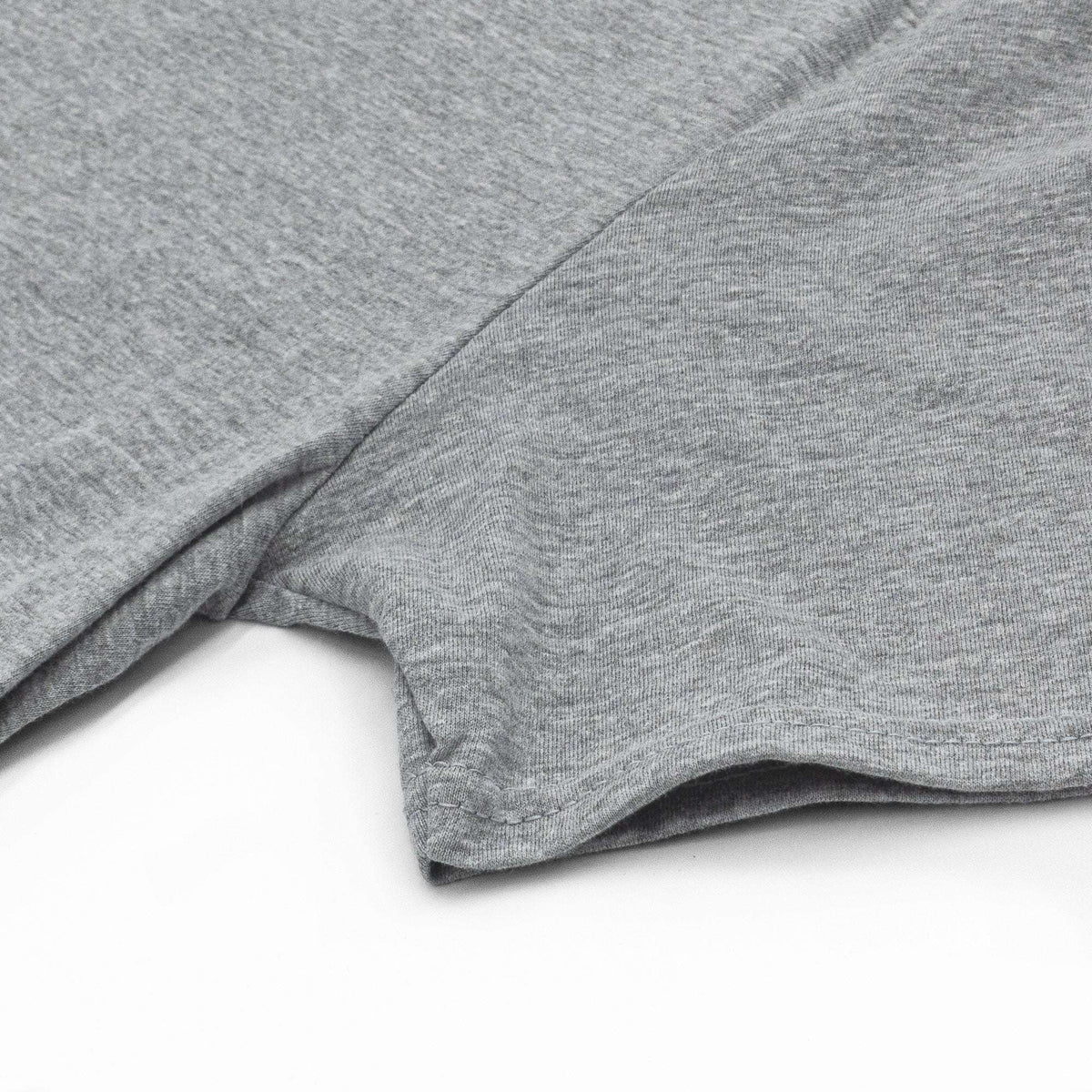 Gray short-sleeve T-shirt sleeve and hem seam close-up