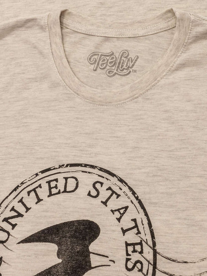 Oatmeal heather crew-neck t-shirt close-up with TeeLuv logo and USPS postmark seal