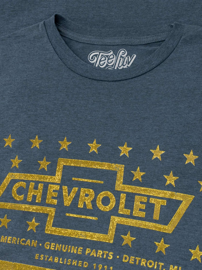Gray heather T-shirt close-up of gold Chevrolet emblem with stars