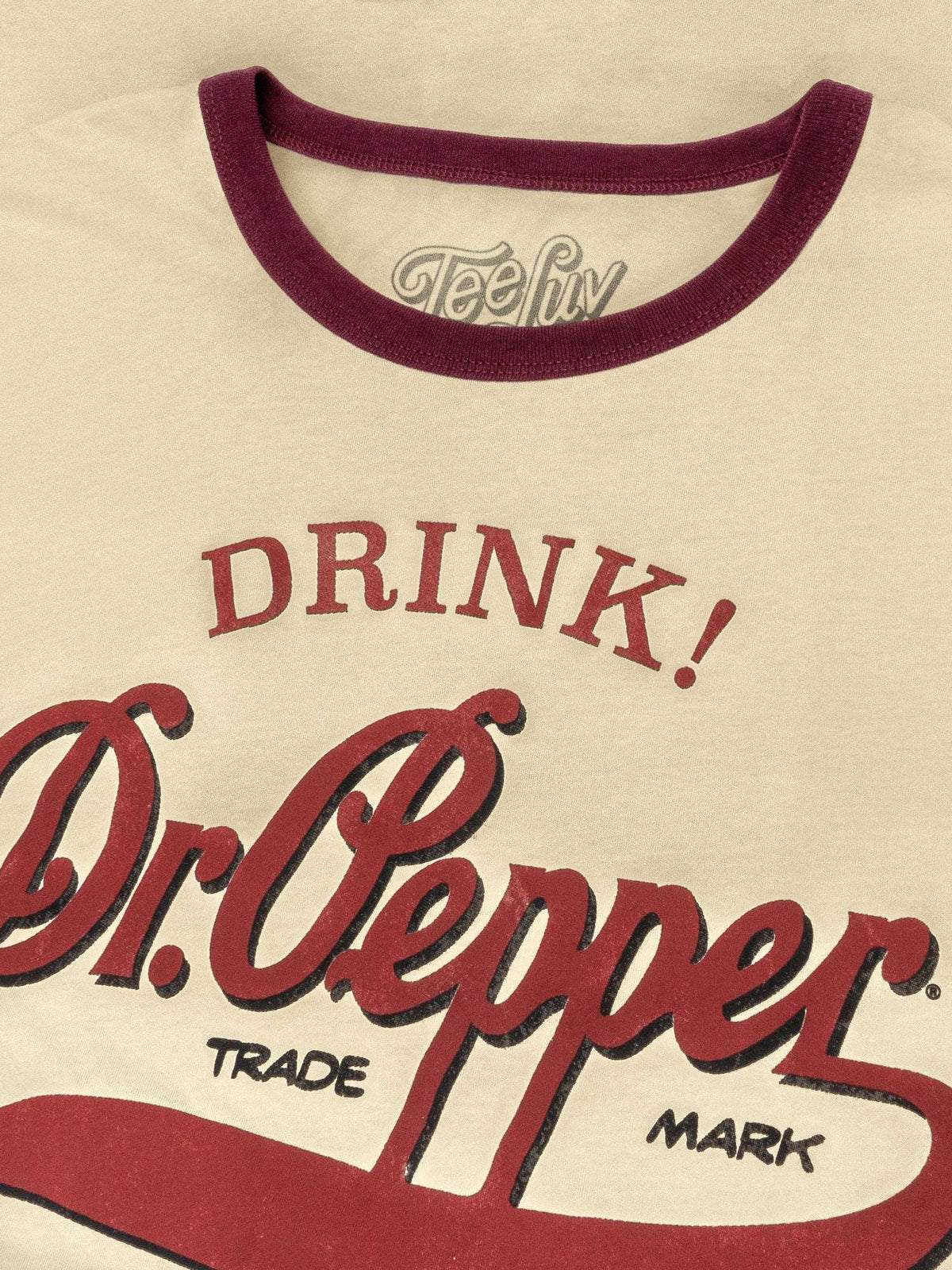 Beige ringer T-shirt close-up: maroon collar and Dr Pepper logo print