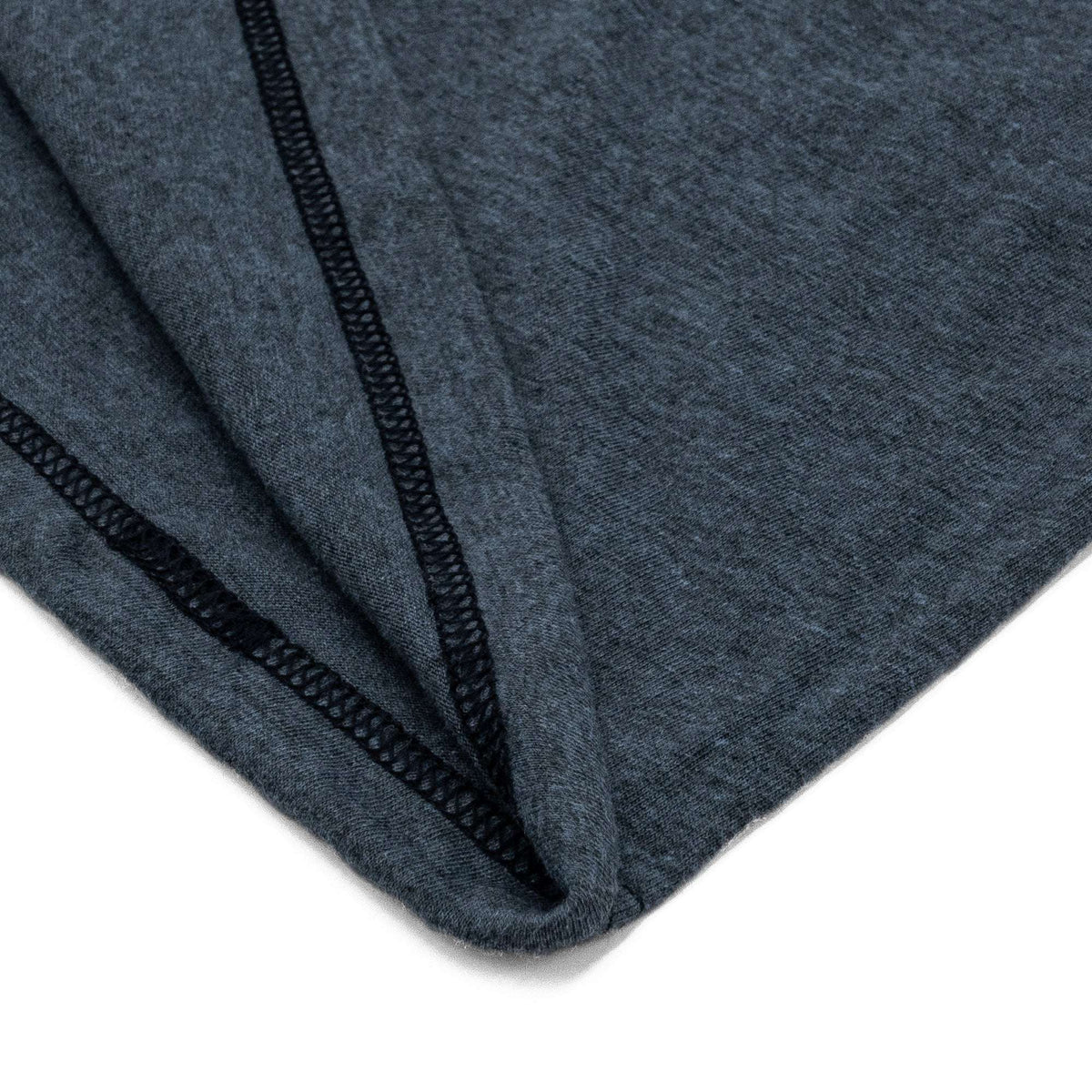 Indigo black heather T-shirt fabric and stitched sleeve seam close-up