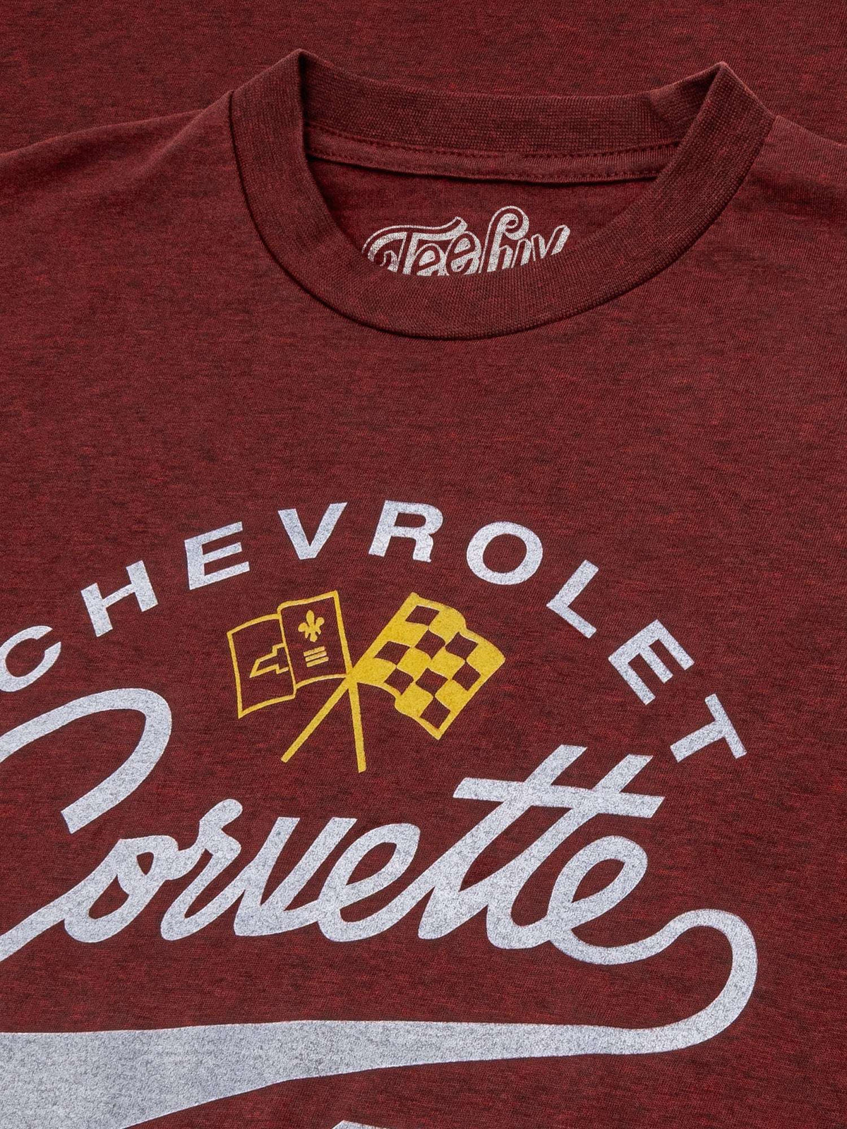 Crimson heather T-shirt showing Chevrolet Corvette script and yellow checkered emblem