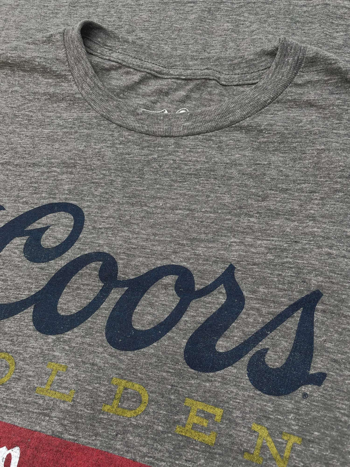 Gray T-shirt crew neckline with TeeLuv logo and partial Coors lettering
