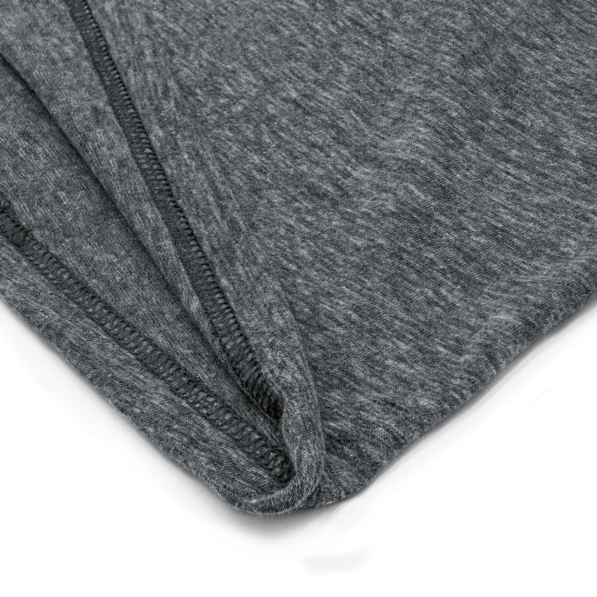Gray T-shirt side seam and folded hem close-up