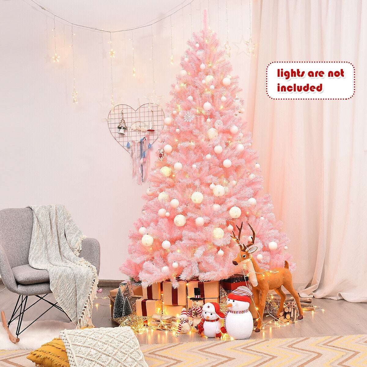 Pink artificial Christmas tree decorated with ornaments; lights are not included