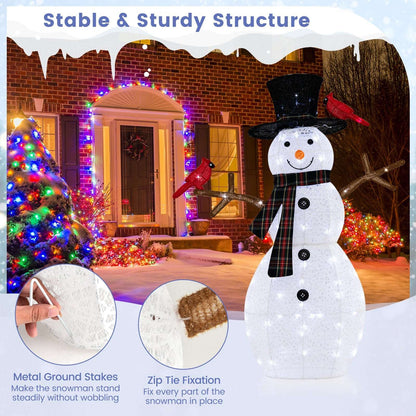 Lighted snowman decoration with redbirds and branch arms; inset shows ground stakes and zip ties
