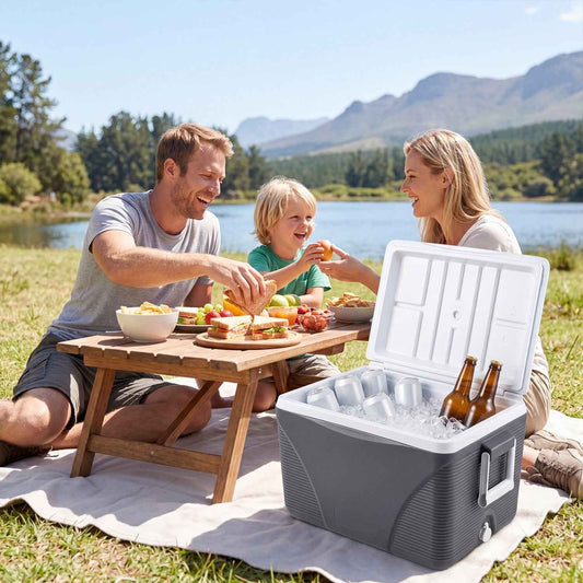 Portable hard cooler in dark gray with open lid showing food and drink bottles