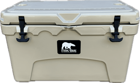 Cream hard cooler with black latch handles and Polar Bear logo badge on front.
