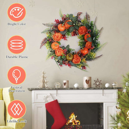 Decorative autumn wreath with orange faux pumpkins, orange flowers, and leafy greenery