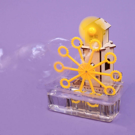 Bubble machine STEM kit: wooden gear tower with fan spinning, blowing bubbles